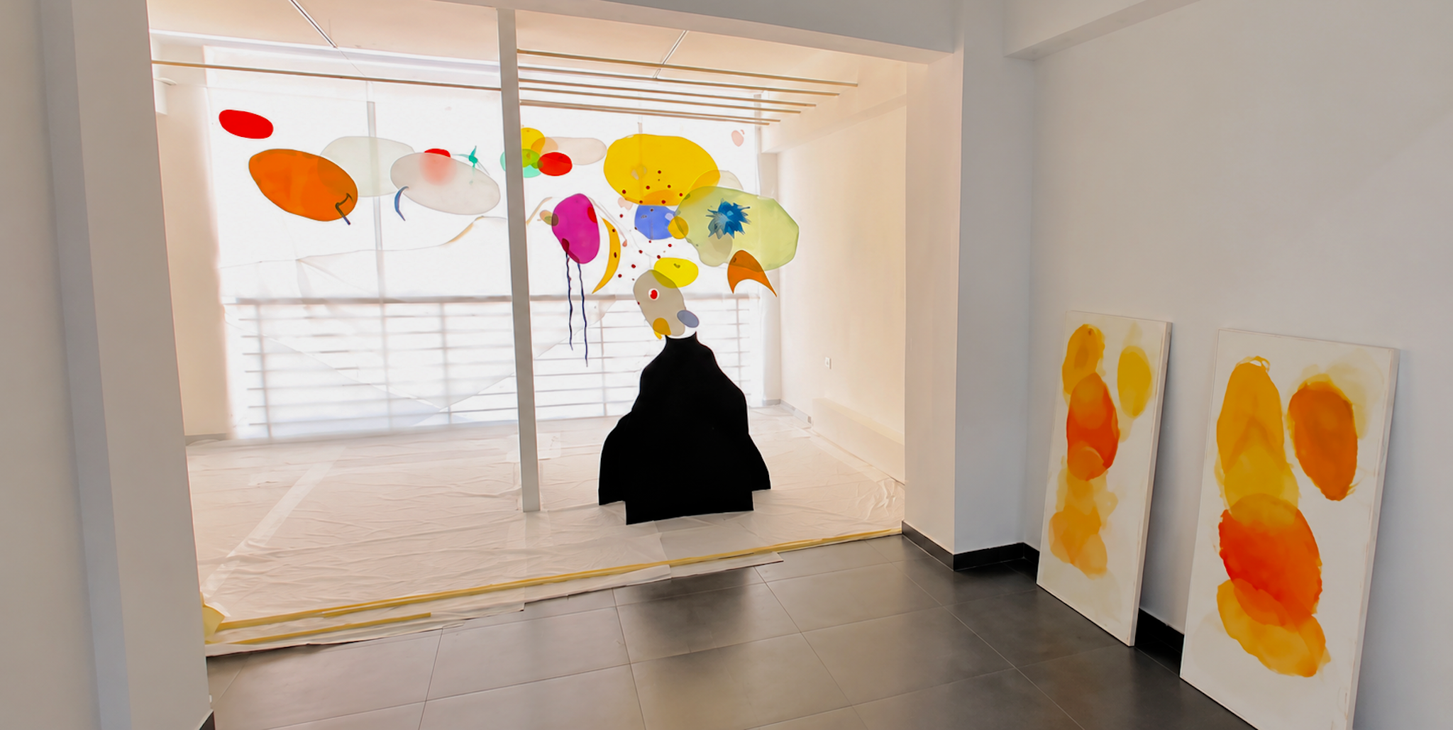 Installation view of paintings by Fadi Elchamaa.